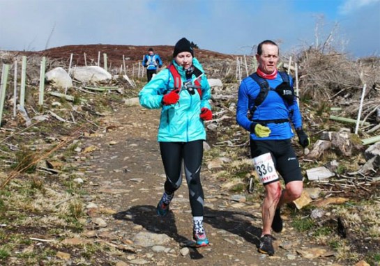 Grellan McGrath with the usual blood splattered legs descending for one of the many peaks on the Wicklow Way Ultra
