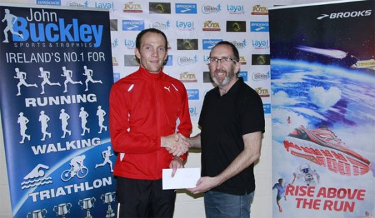 Colm Sheahan (L)...winner of the 2014 Cheetah Run receiving his prize from Jor Roche (R) of Eagle AC